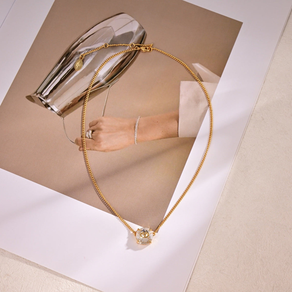 Martin Graham pendant necklace in polished metal-tone – front view