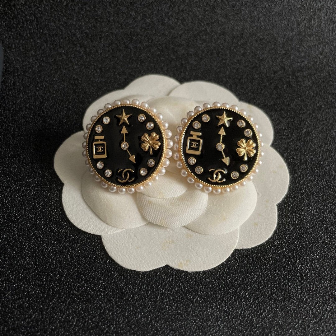 Martin Graham stud earrings in polished metal-tone – front product view