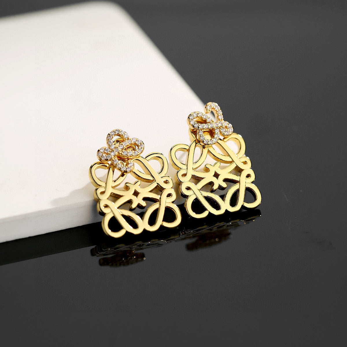 Martin Graham stud earrings in polished metal-tone – front view