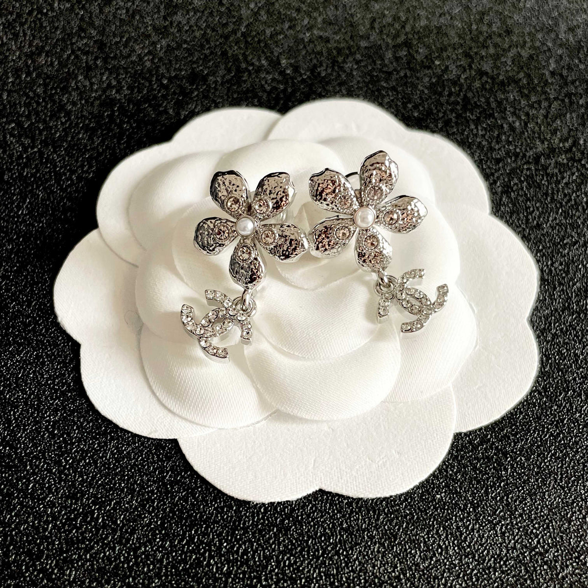 Martin Graham stud earrings in polished metal-tone – front product view