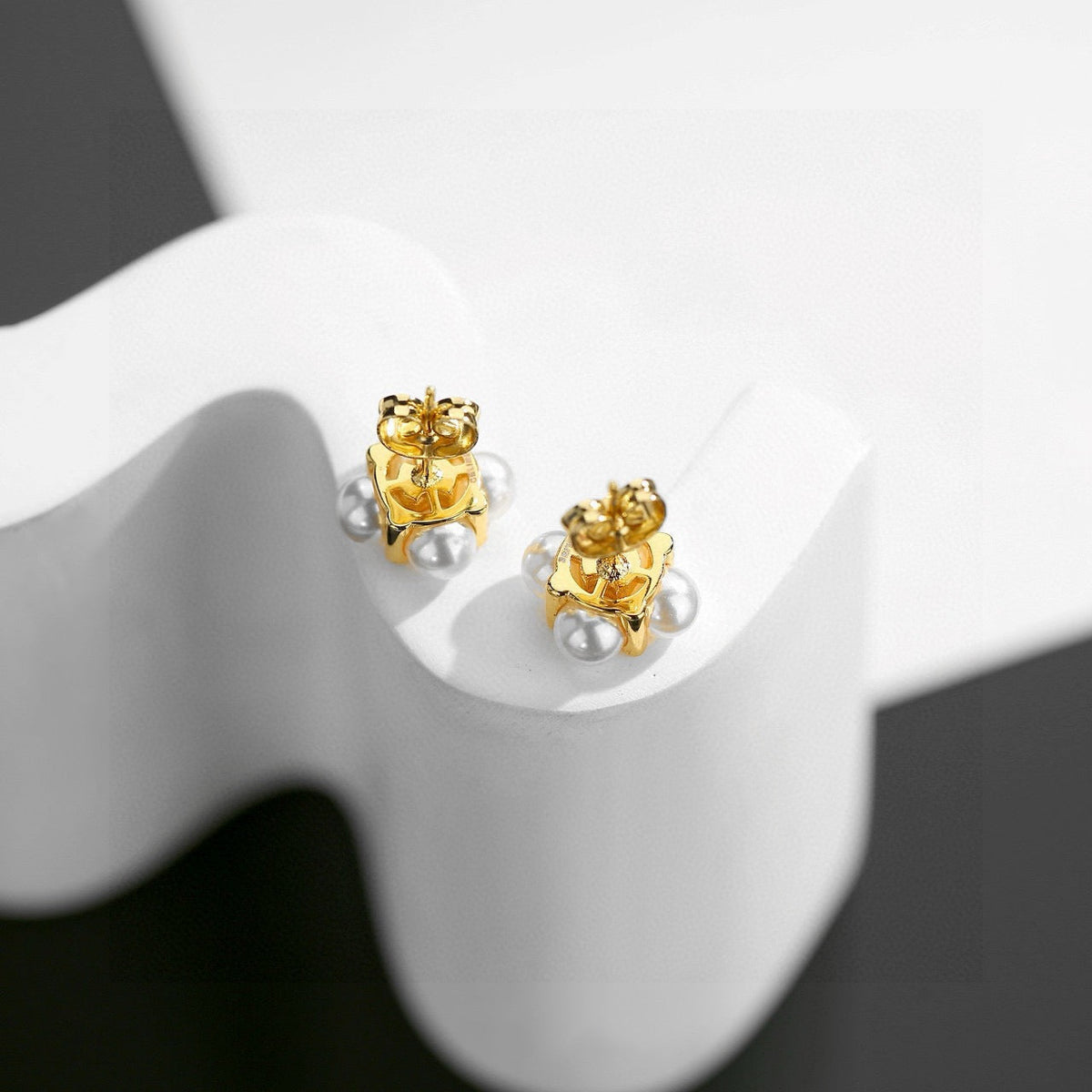 Martin Graham stud earrings in polished metal-tone – front view
