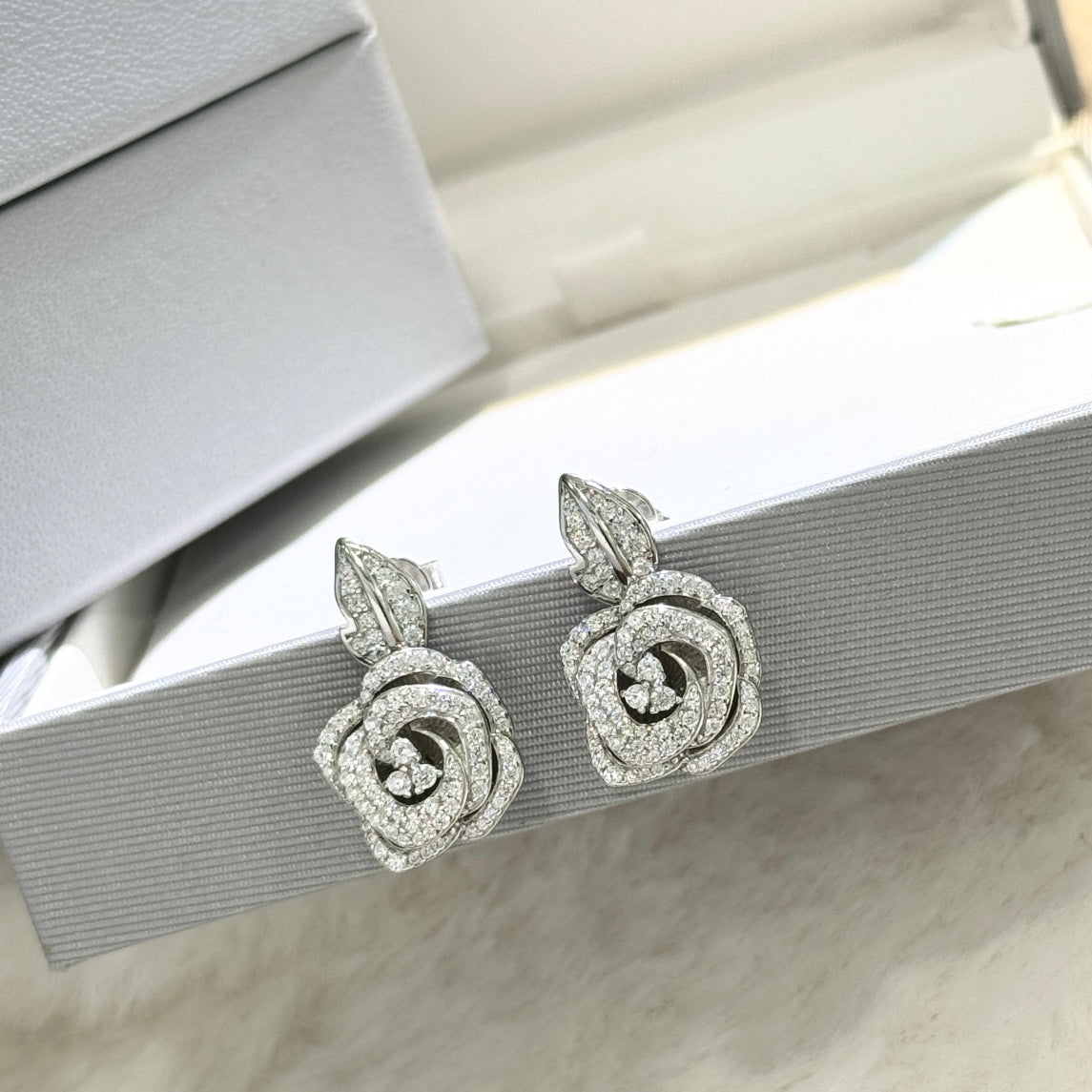 Martin Graham stud earrings in polished metal-tone – front view