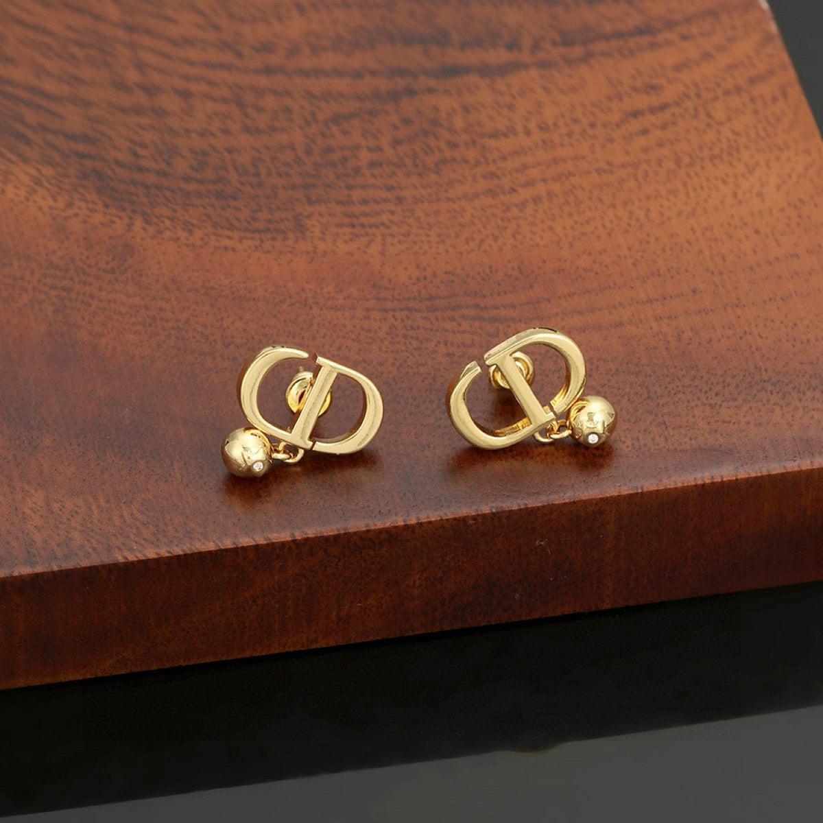 Martin Graham earrings in polished metal-tone – front view