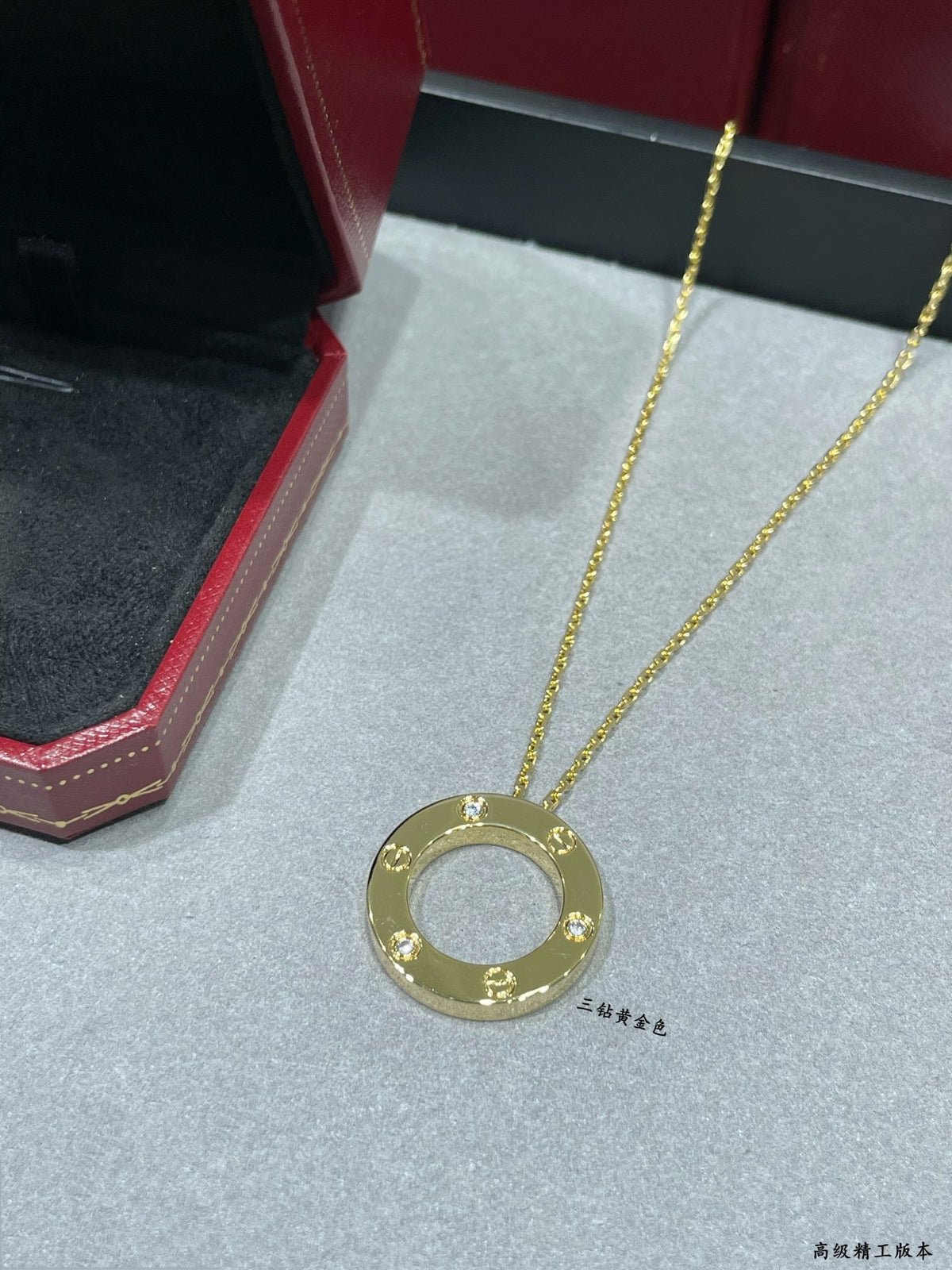 Martin Graham pendant necklace in polished metal-tone – front view
