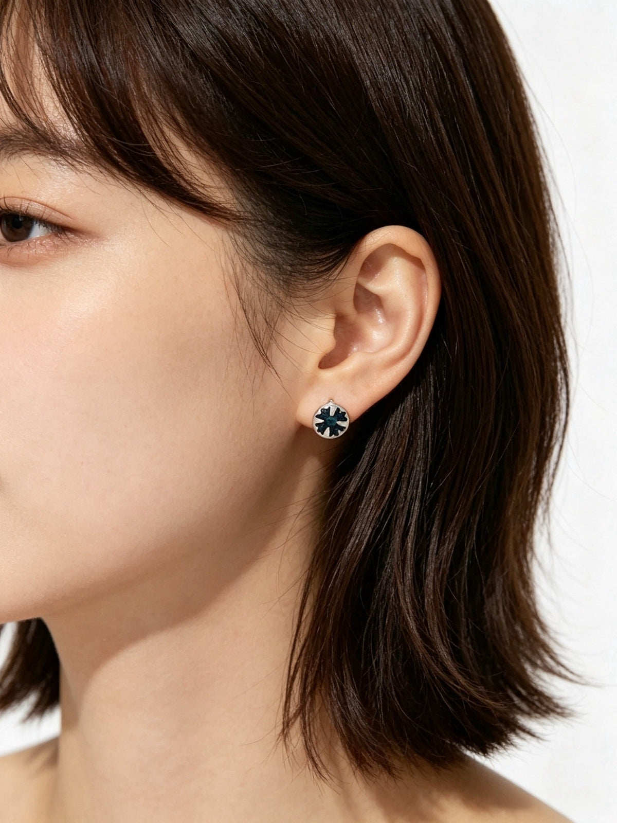 Martin Graham earrings in polished metal-tone – front product view