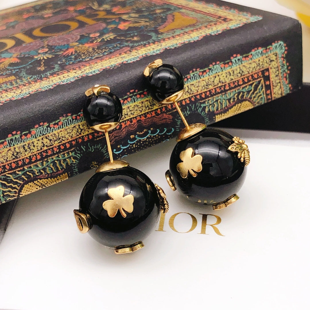 Martin Graham stud earrings in polished metal-tone – front view