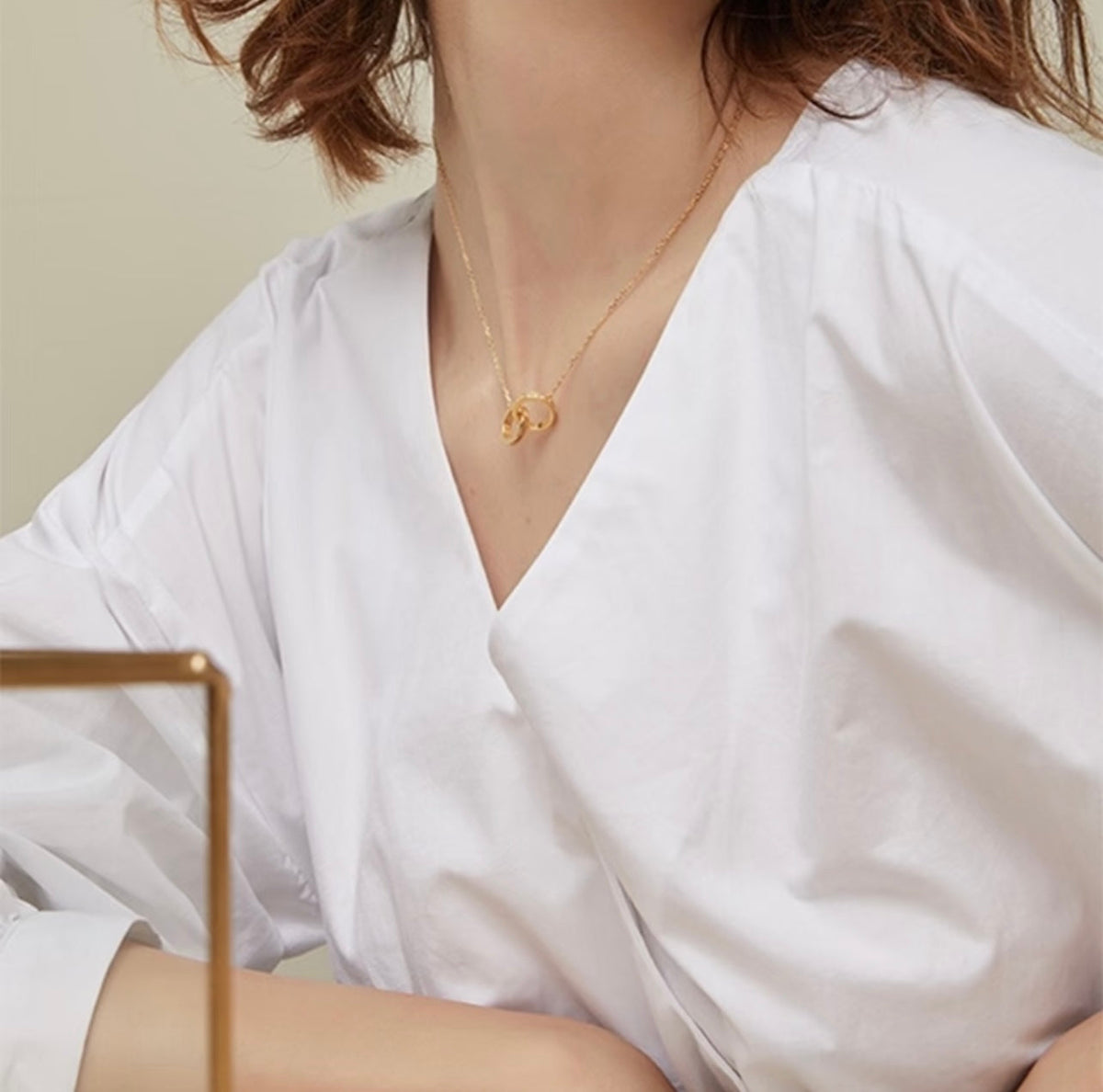 Martin Graham pendant necklace in polished metal-tone – front view