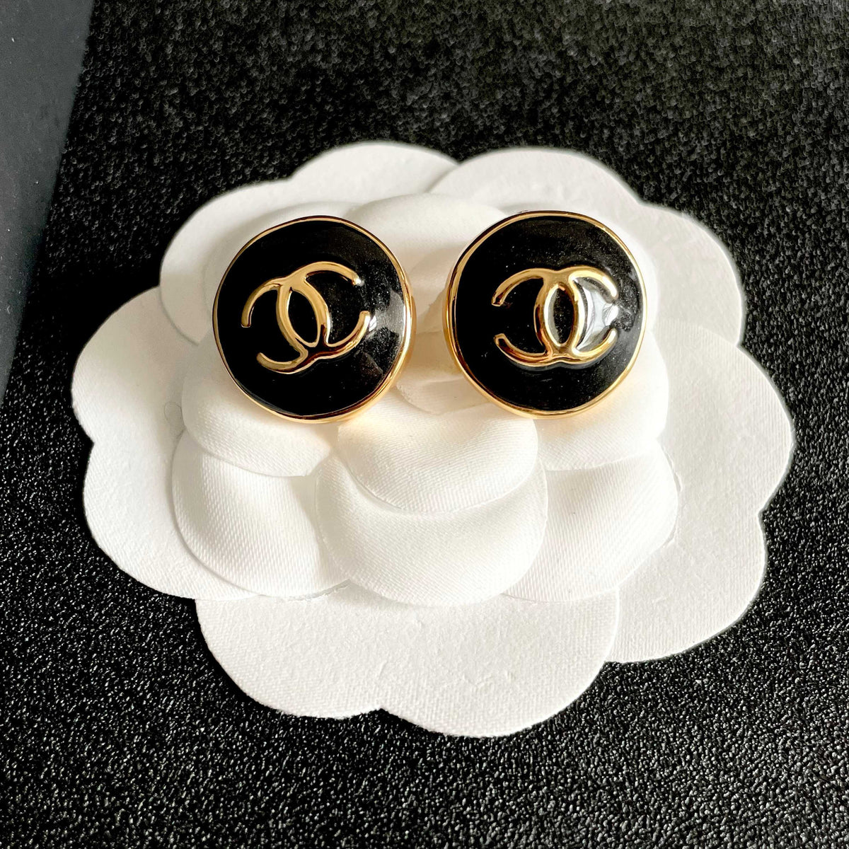 Martin Graham stud earrings in polished metal-tone – front product view