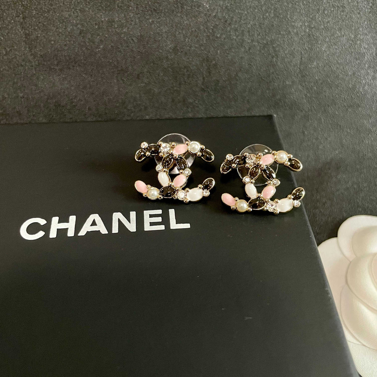Martin Graham stud earrings in polished metal-tone – detail view