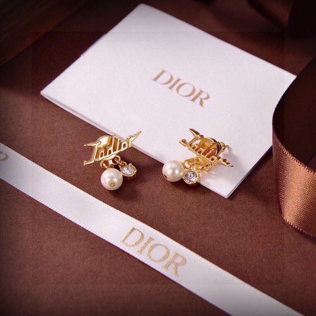 Martin Graham stud earrings in polished metal-tone – detail view