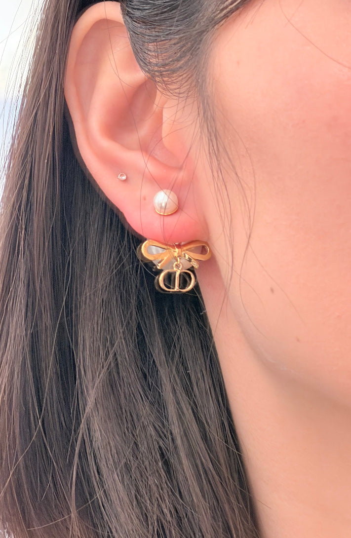 Martin Graham stud earrings in polished metal-tone – detail view