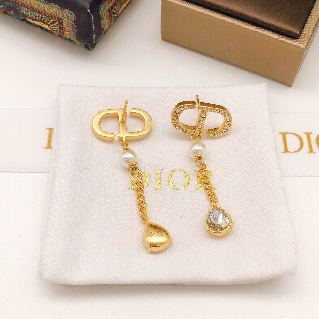 Martin Graham stud earrings in polished metal-tone – detail view