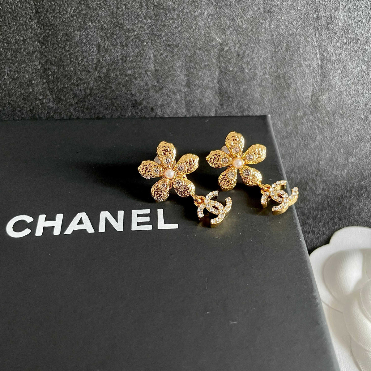 Martin Graham stud earrings in polished metal-tone – detail view