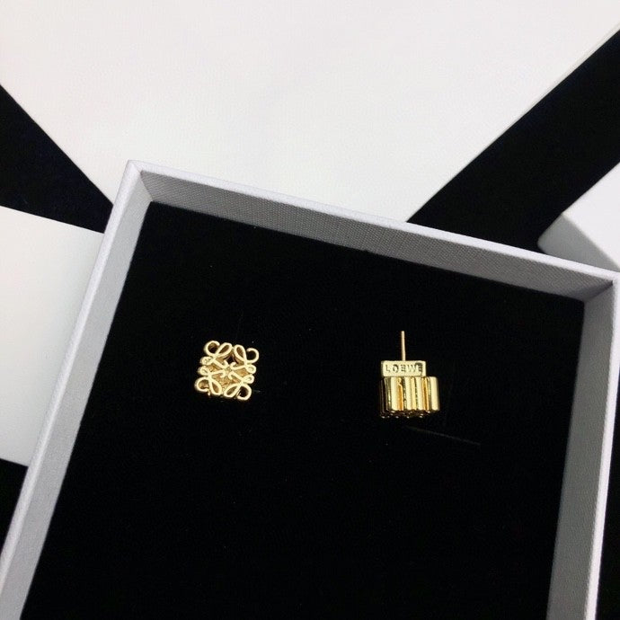 Martin Graham stud earrings in polished metal-tone – detail view