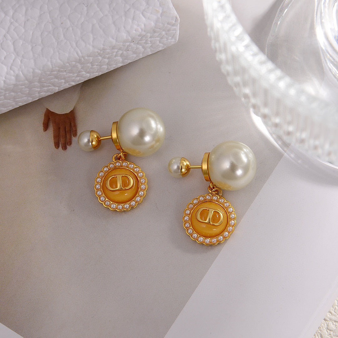 Martin Graham stud earrings in polished metal-tone – detail view