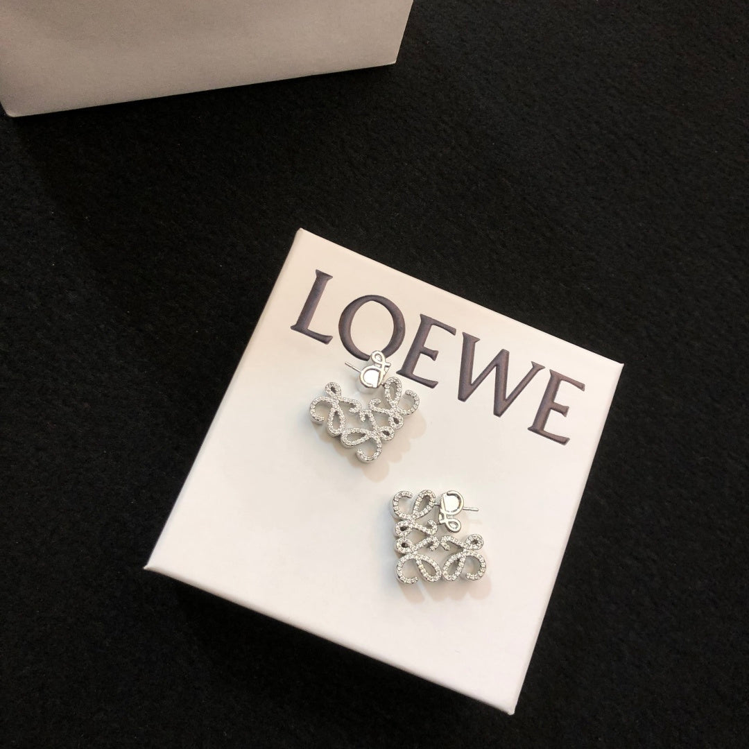 Martin Graham stud earrings in polished metal-tone – detail view