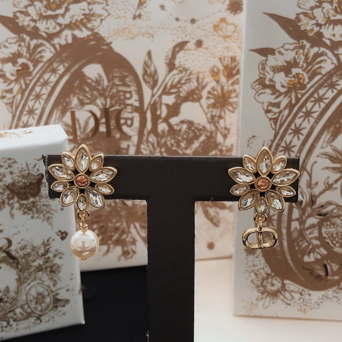 Martin Graham stud earrings in polished metal-tone – detail view
