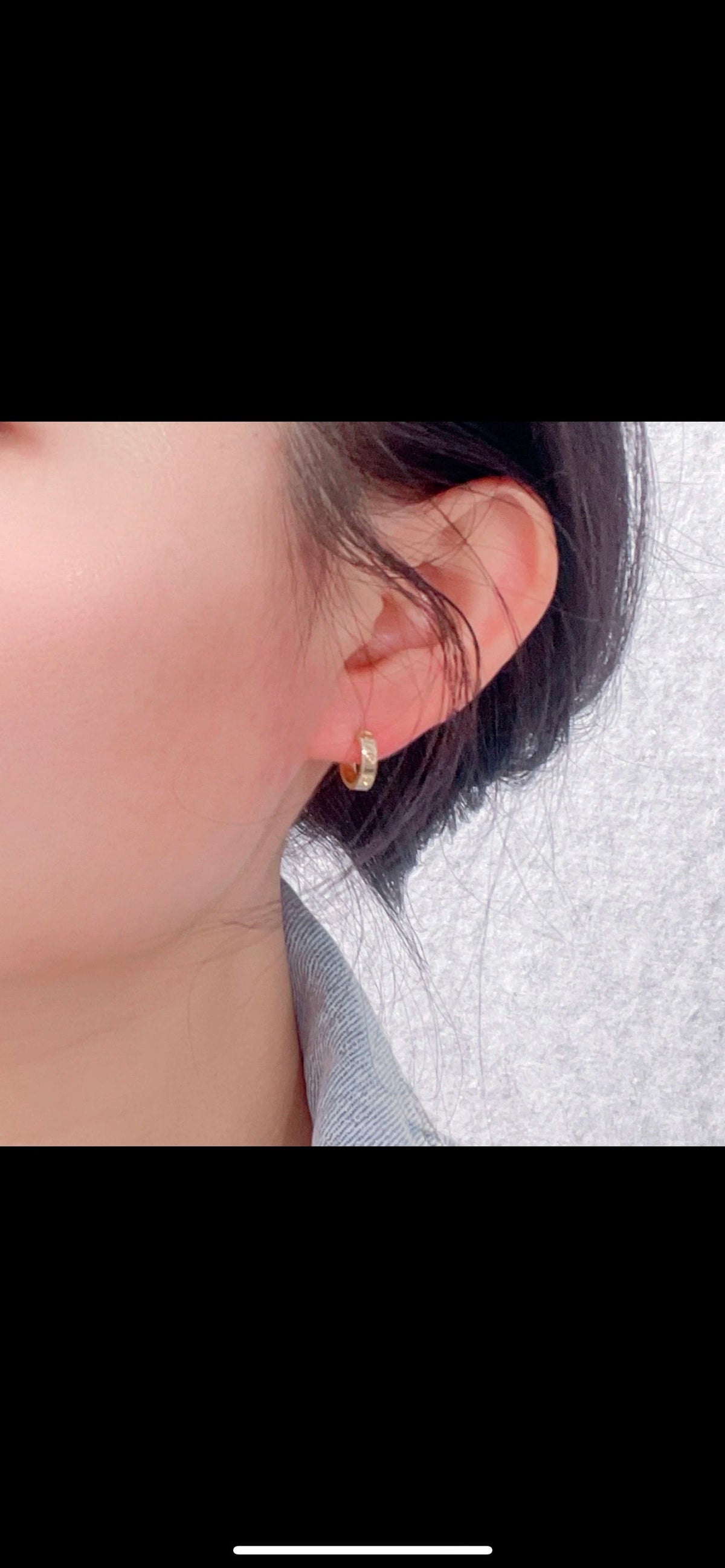 Martin Graham stud earrings in polished metal-tone – detail view