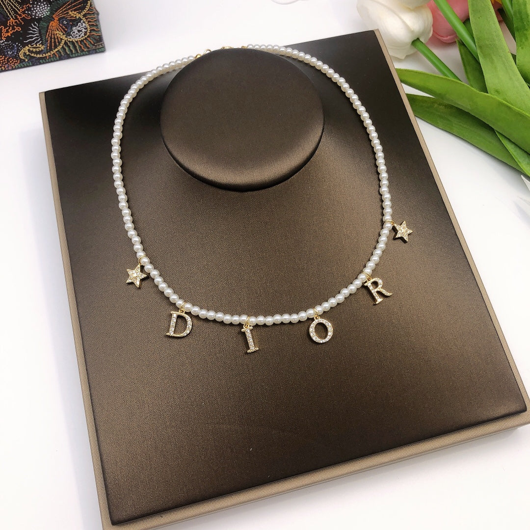 Martin Graham pendant necklace in polished metal-tone – detail view