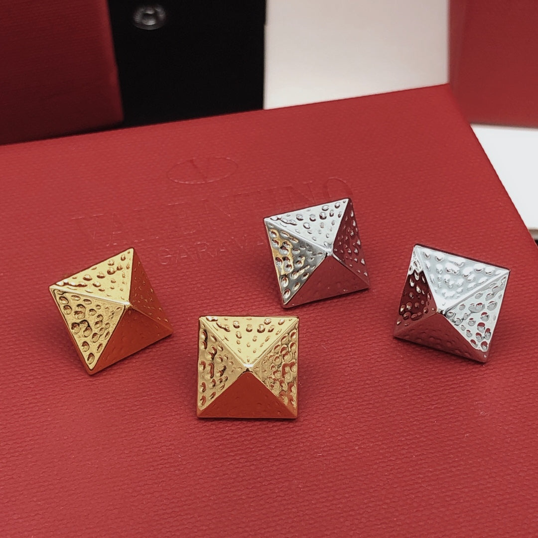 Martin Graham stud earrings in polished metal-tone – detail view