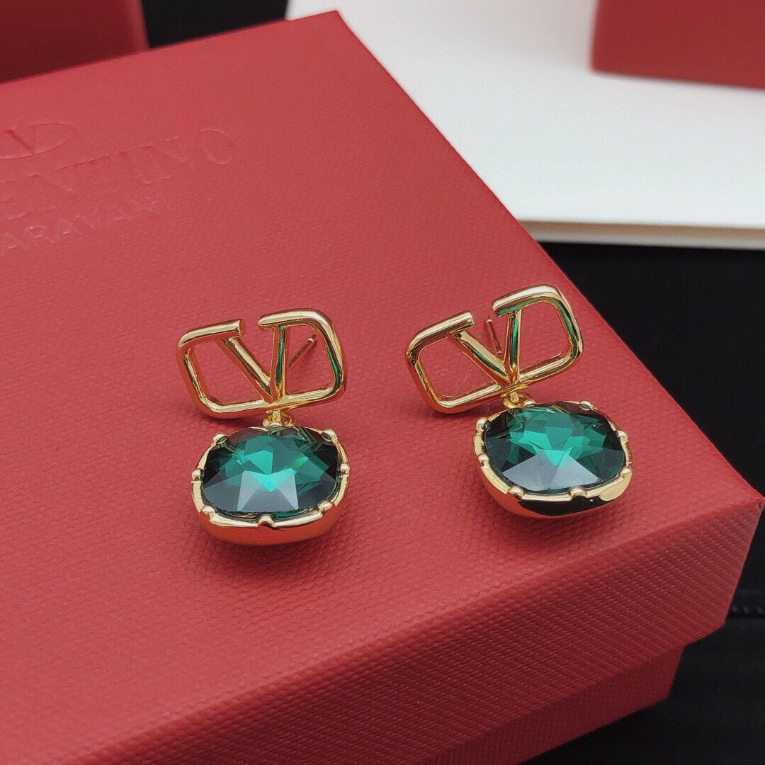 Martin Graham stud earrings in polished metal-tone – detail view