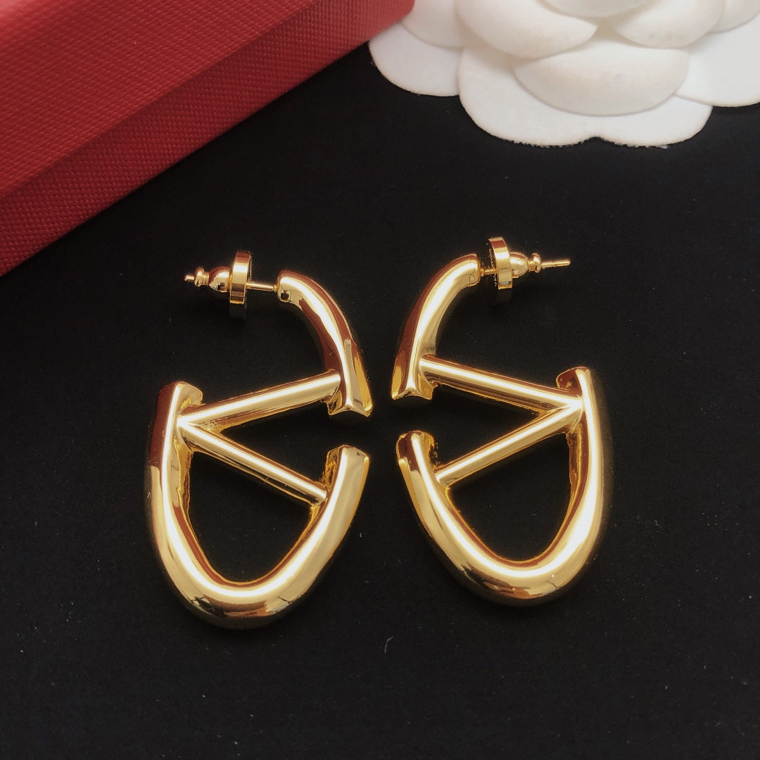 Martin Graham drop earrings in polished metal-tone – detail view