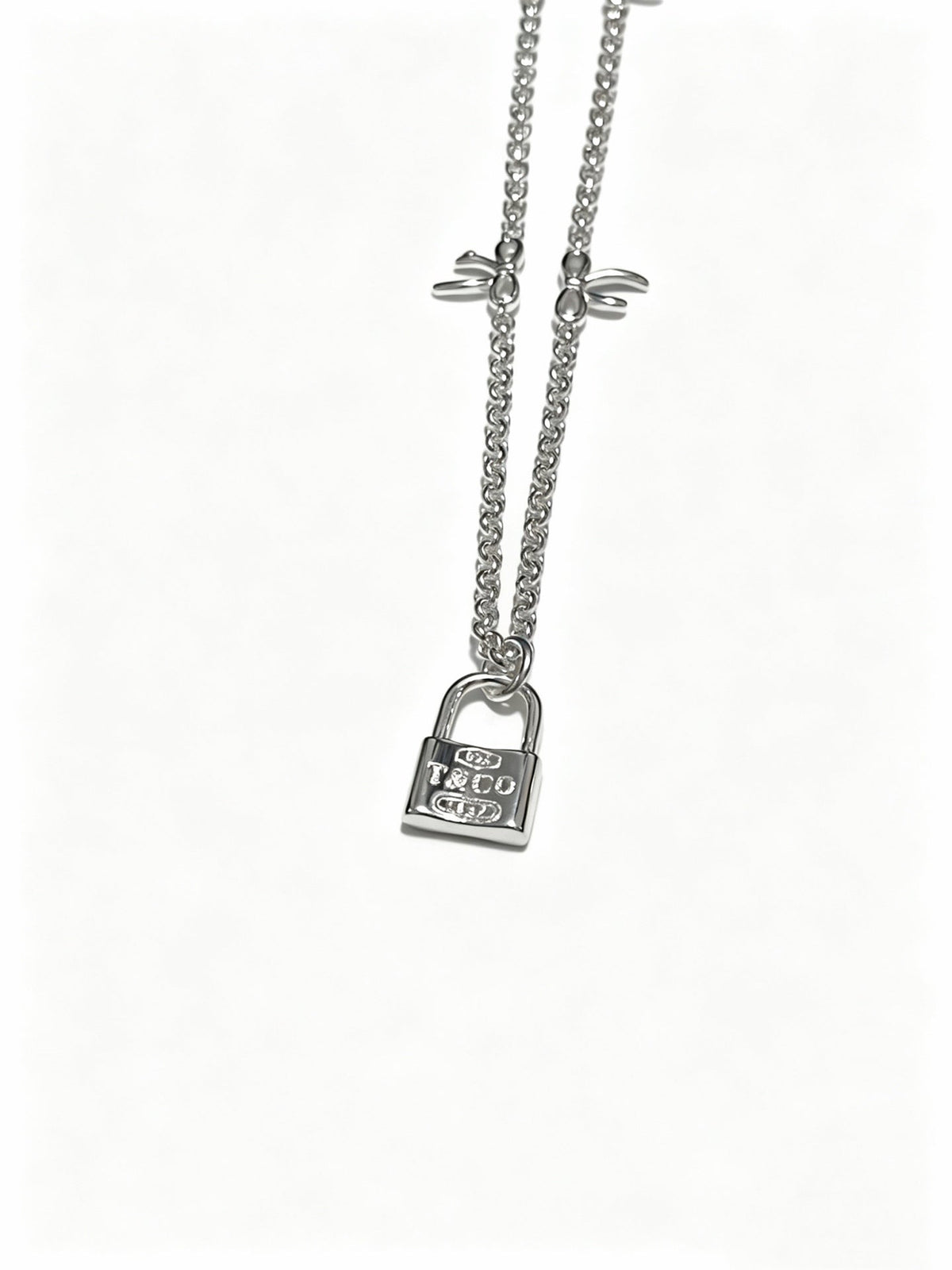 Martin Graham pendant necklace in polished metal-tone – detail view
