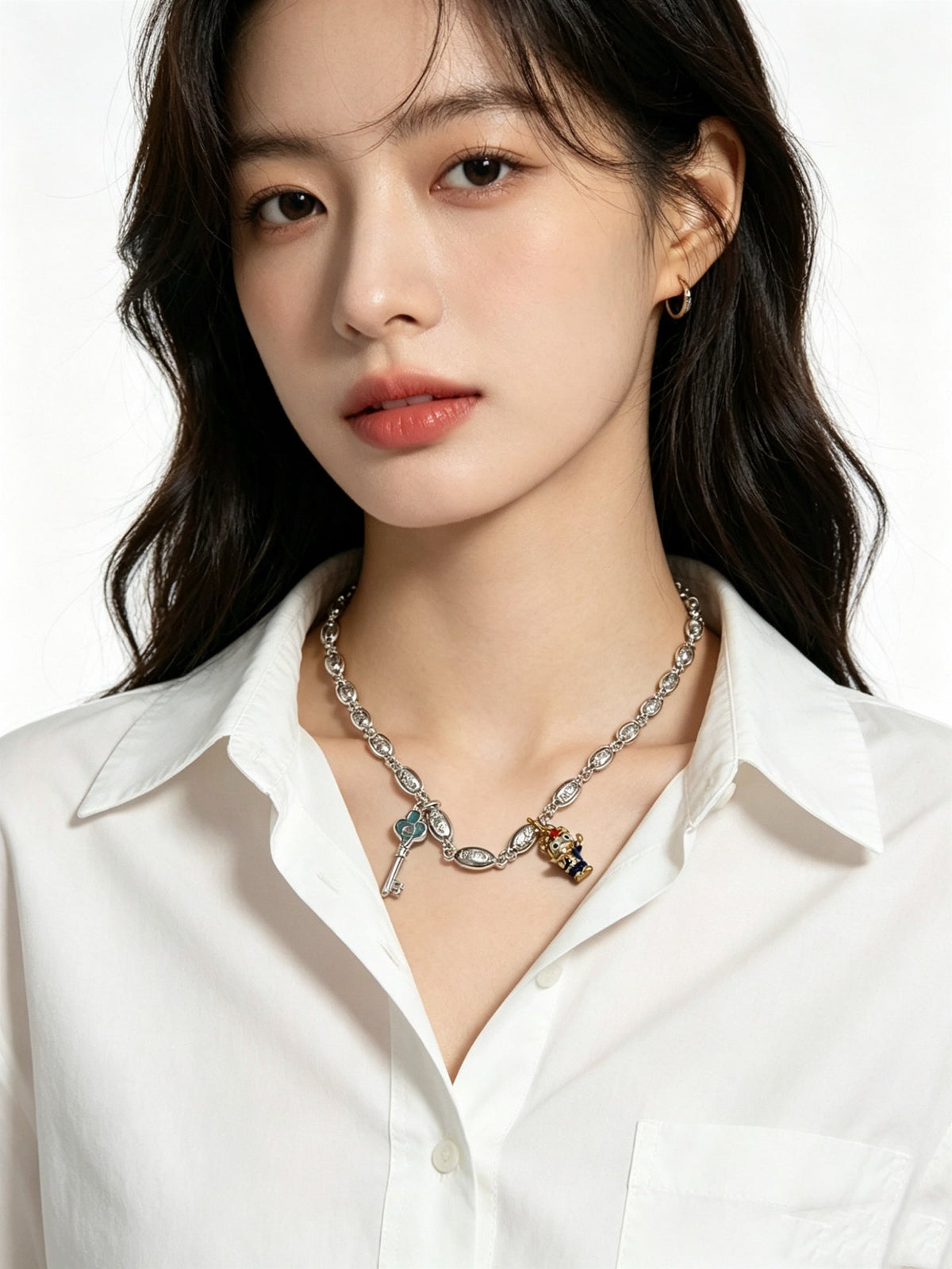 Martin Graham pendant necklace in polished metal-tone – detail view