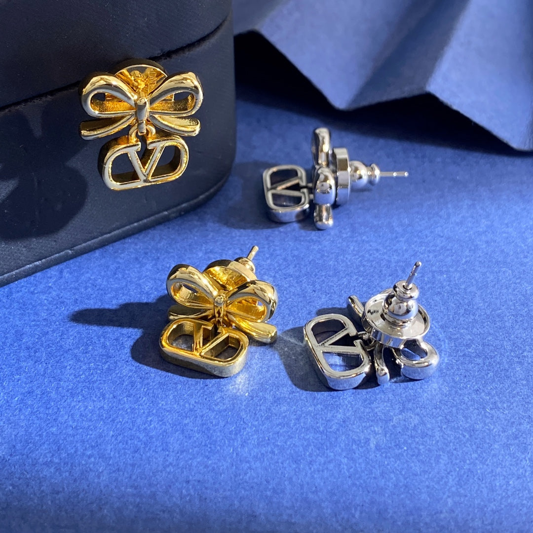 Martin Graham stud earrings in polished metal-tone – detail view