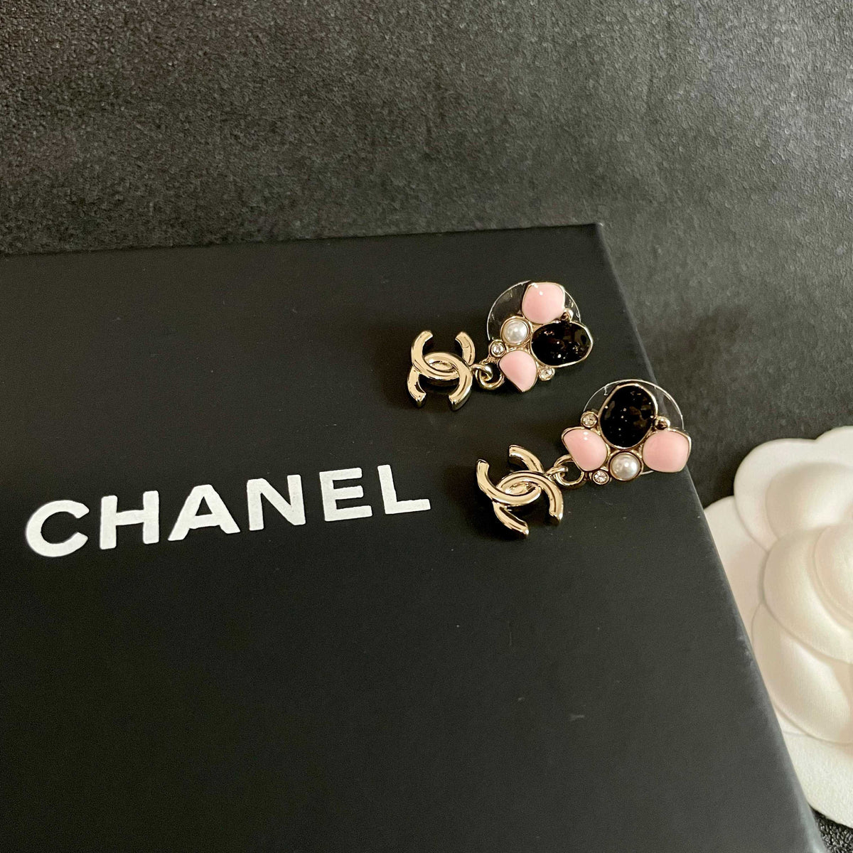 Martin Graham stud earrings in polished metal-tone – detail view
