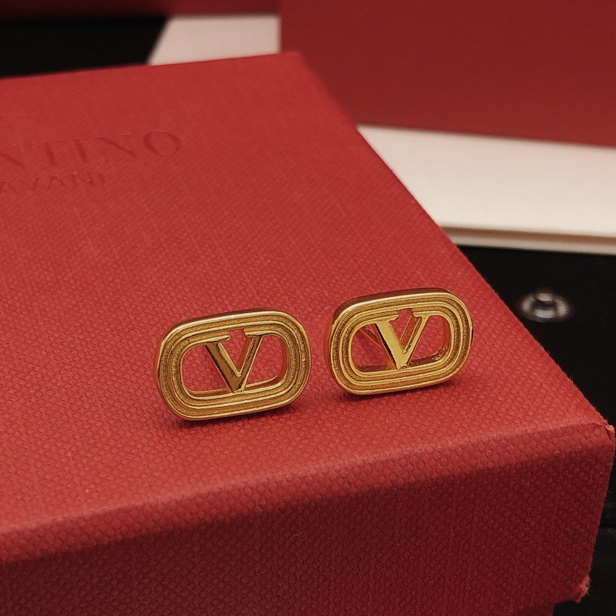 Martin Graham stud earrings in polished metal-tone – detail view