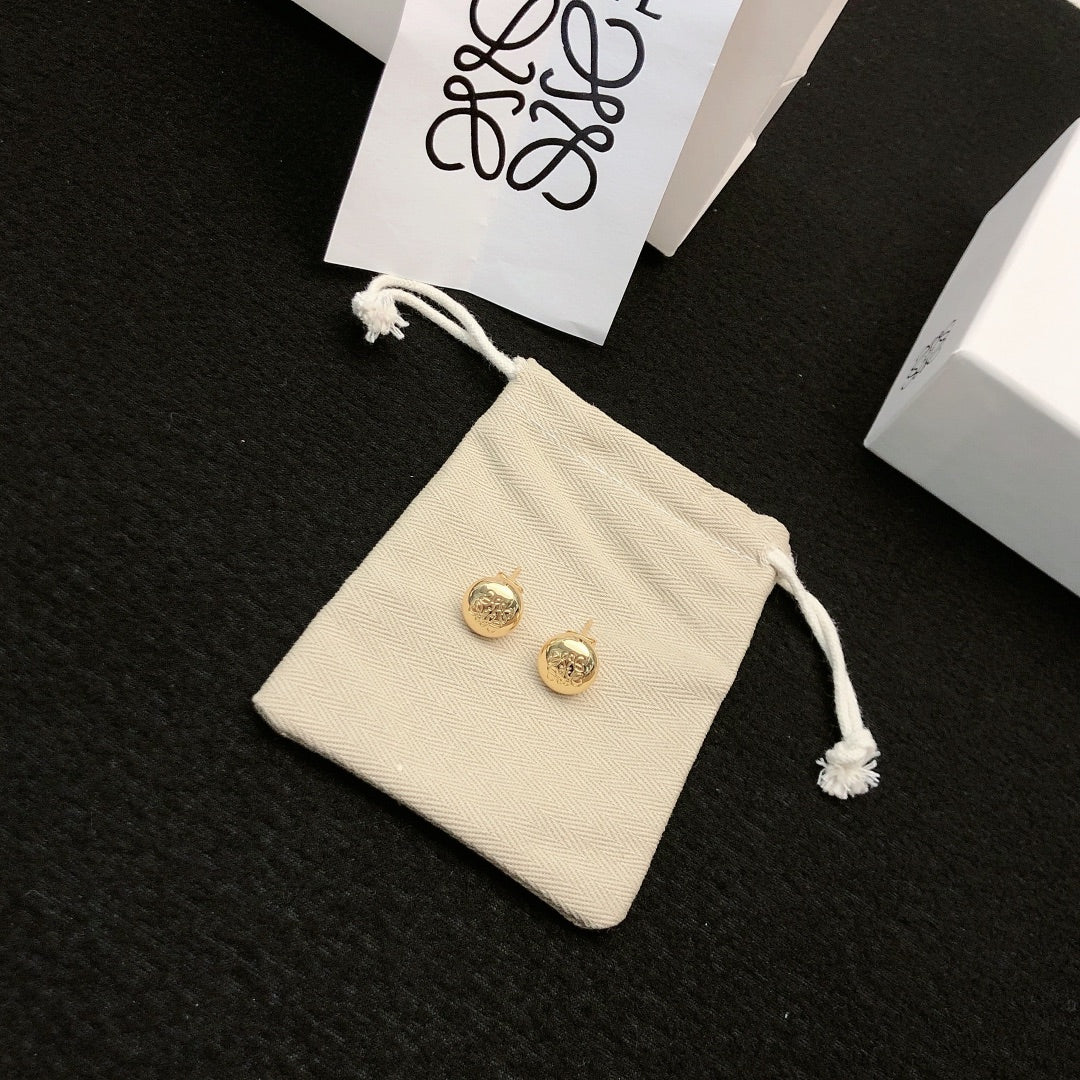 Martin Graham stud earrings in polished metal-tone – detail view