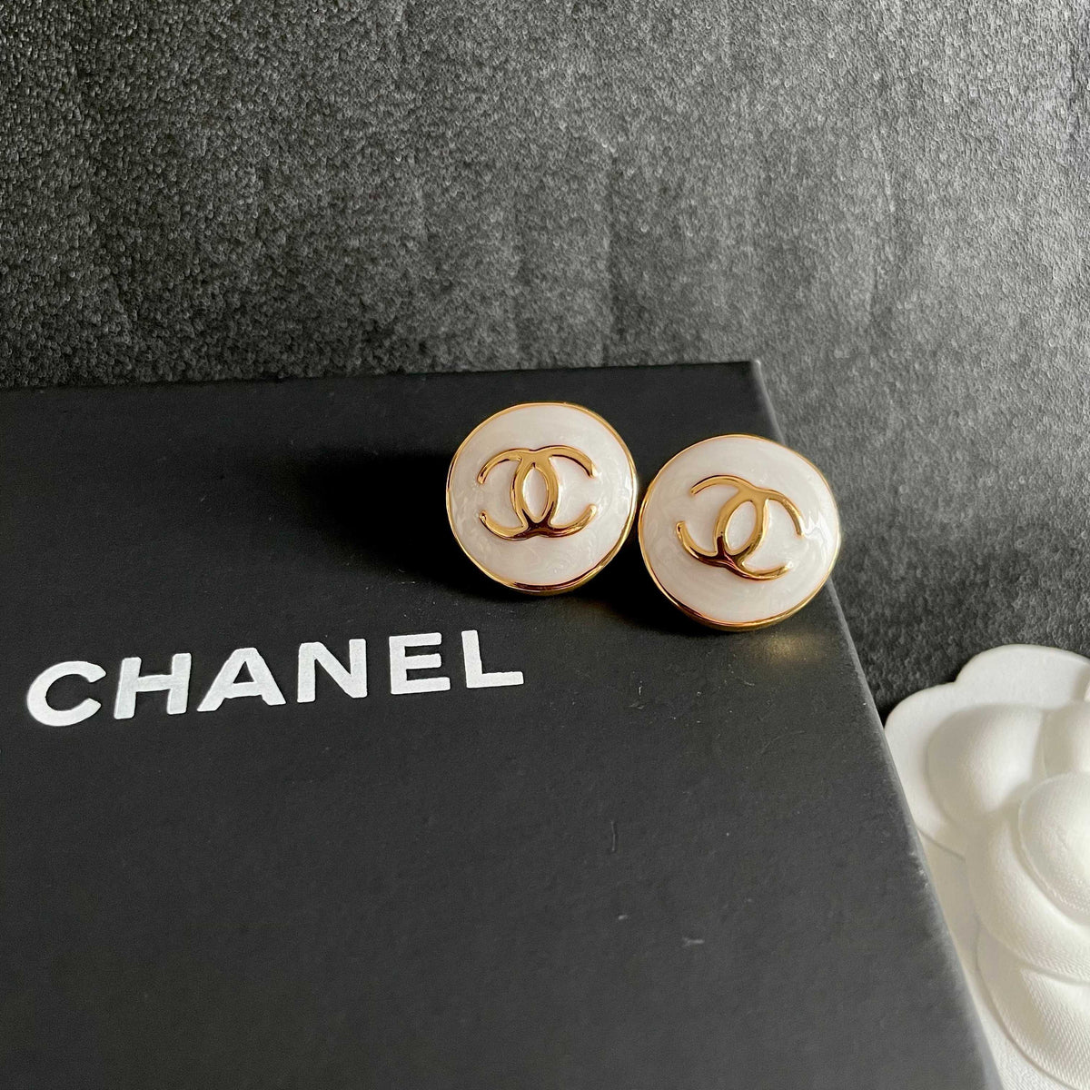 Martin Graham stud earrings in polished metal-tone – detail view