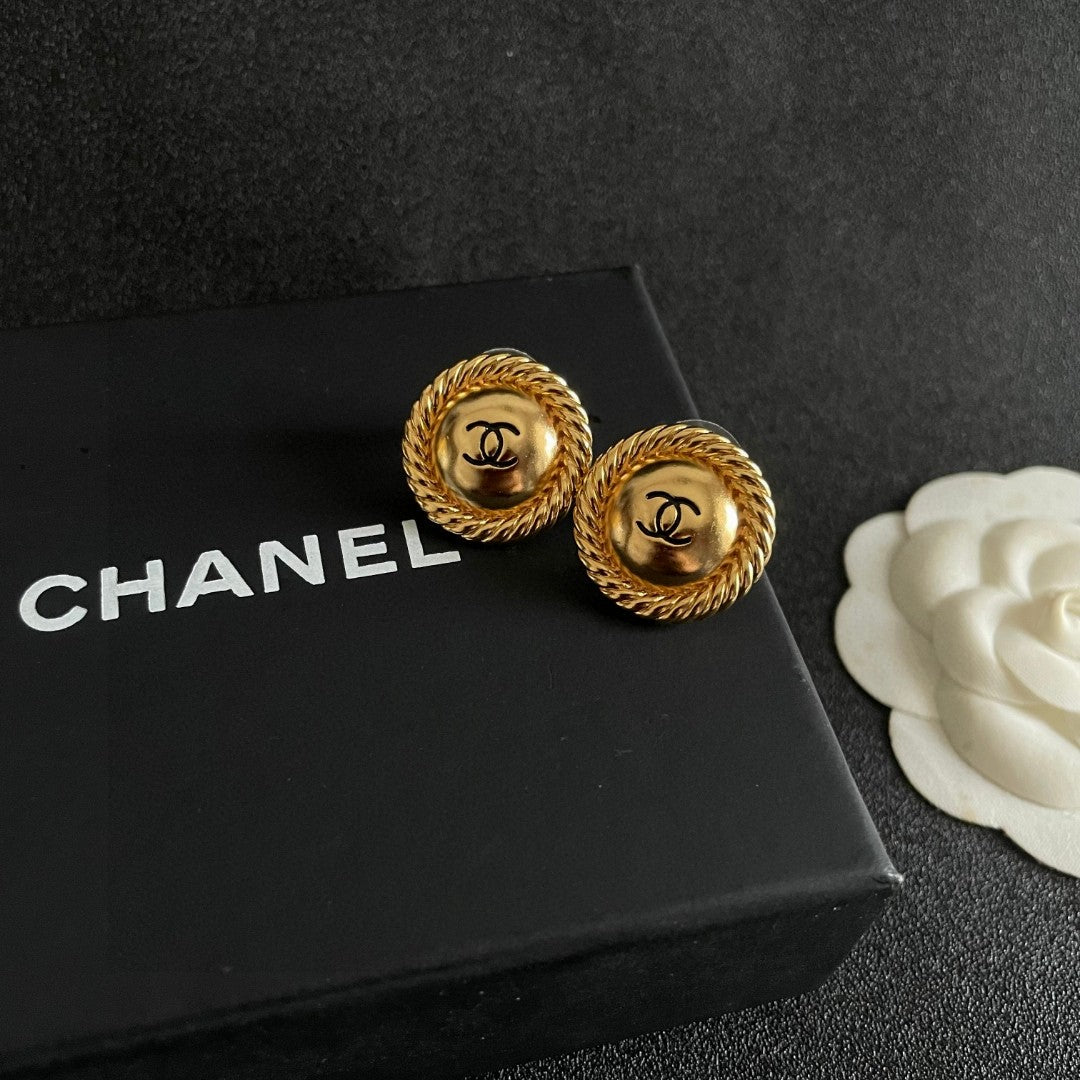 Martin Graham stud earrings in polished metal-tone – detail view