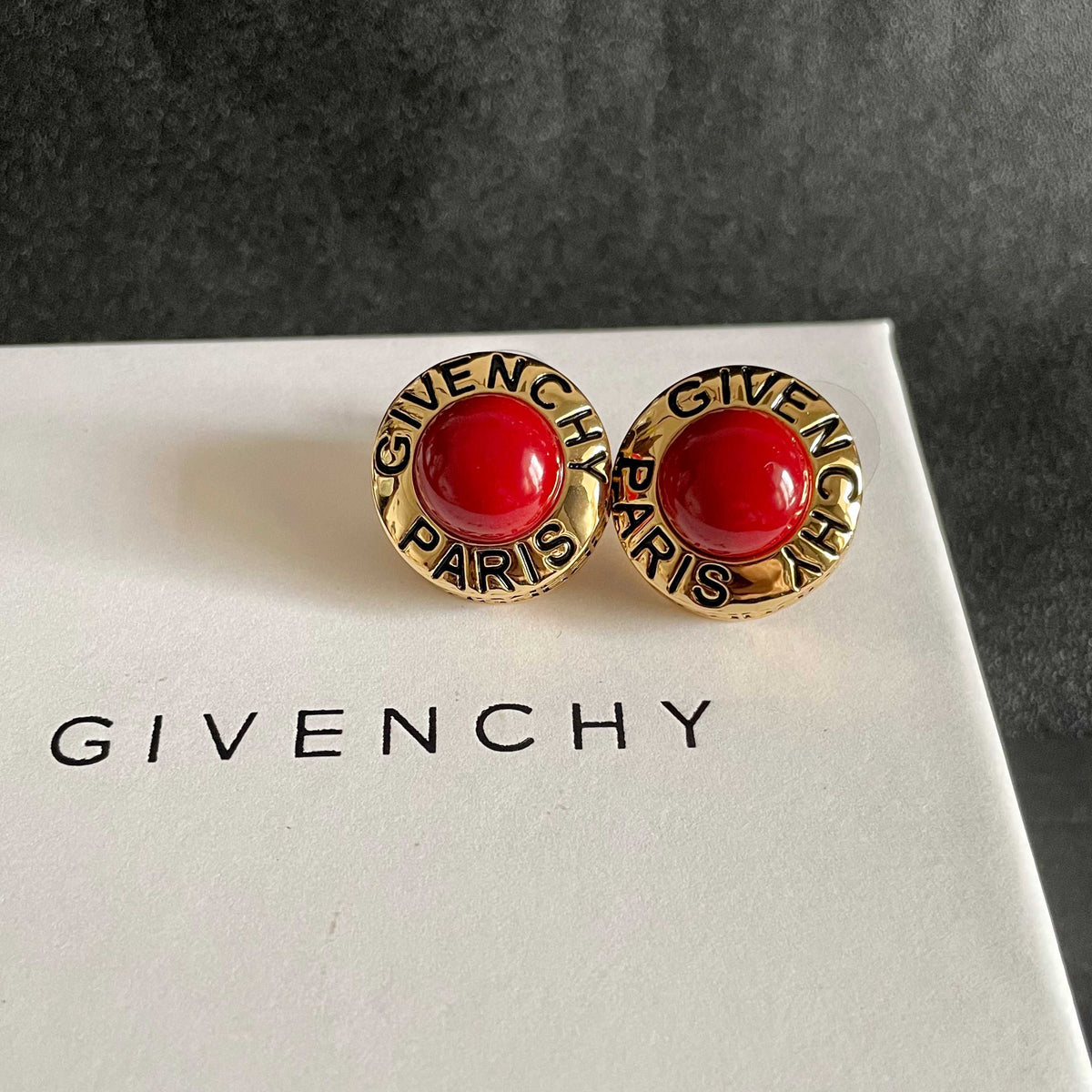 Martin Graham stud earrings in polished metal-tone – detail view