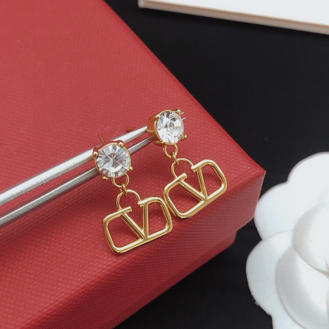 Martin Graham stud earrings in polished metal-tone – detail view